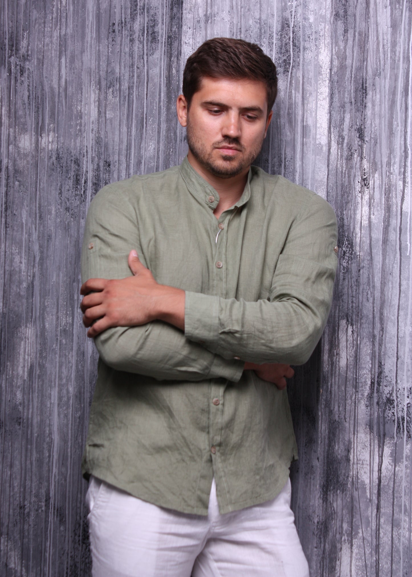 Olive color shirt made of natural linen with a stand-up collar and long sleeves