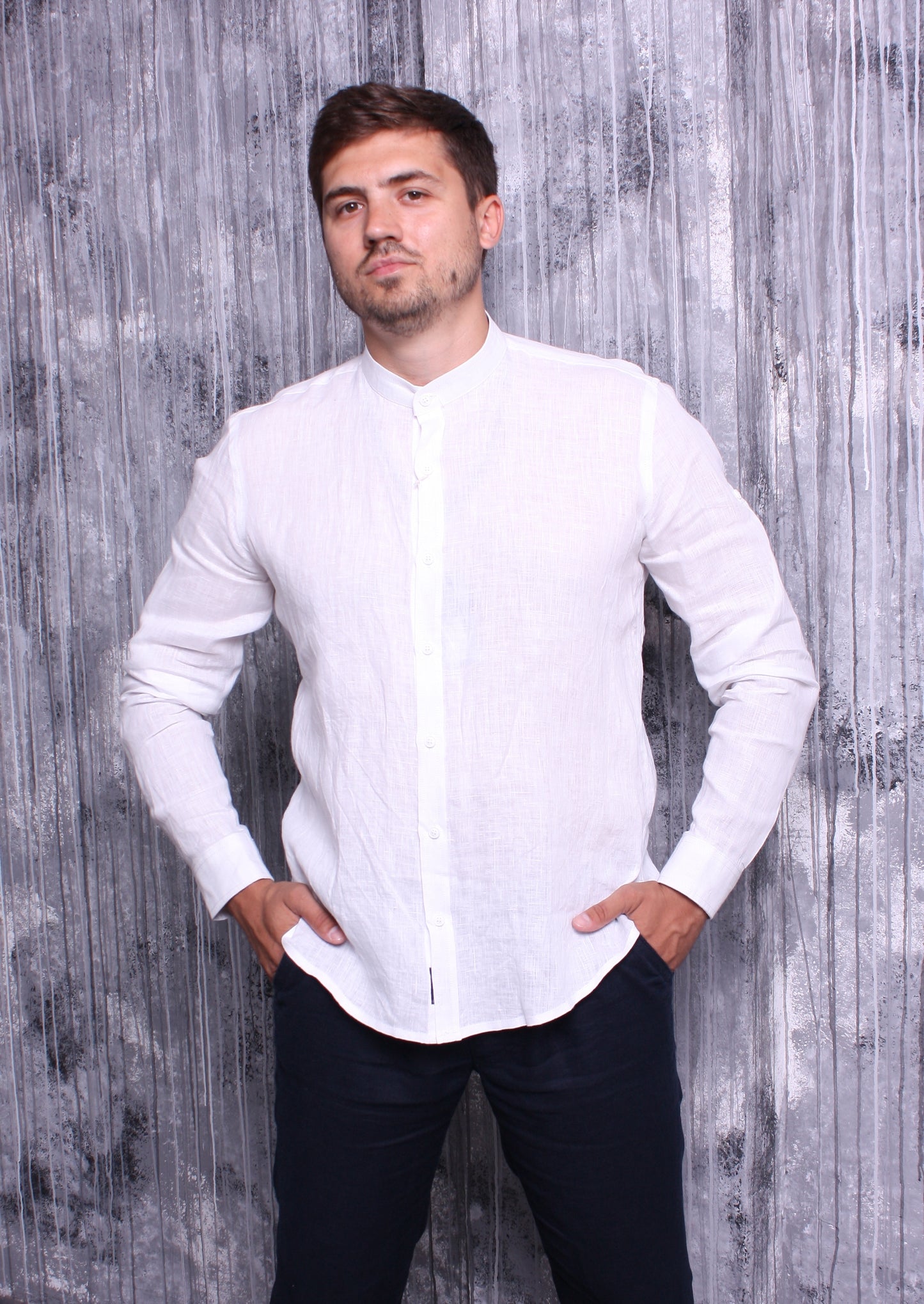 White shirt made of natural linen with a stand-up collar and long sleeves