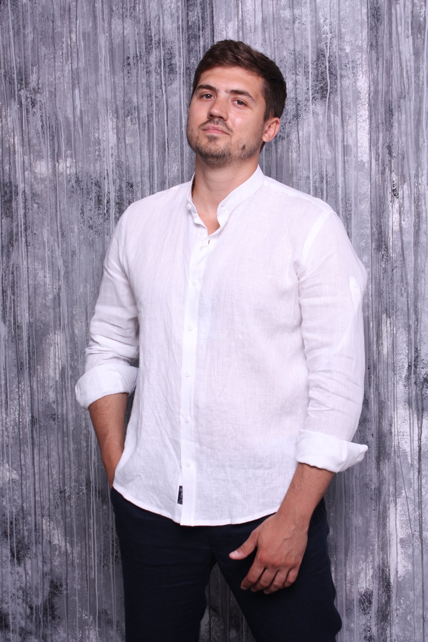 White shirt made of natural linen with a stand-up collar and long sleeves