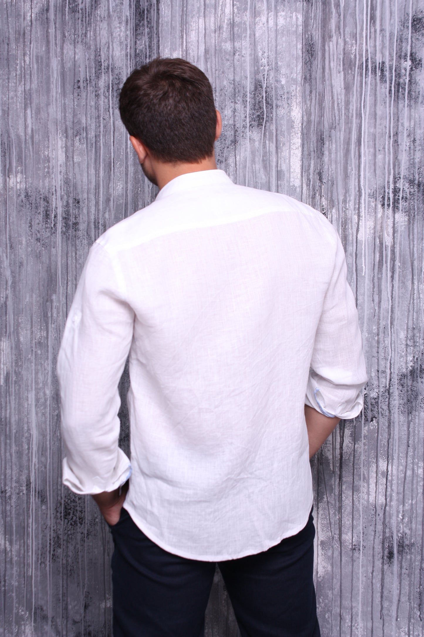 White shirt made of natural linen with a stand-up collar and long sleeves